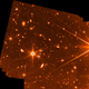 A star and thousands of galaxies seen in a Webb test image.